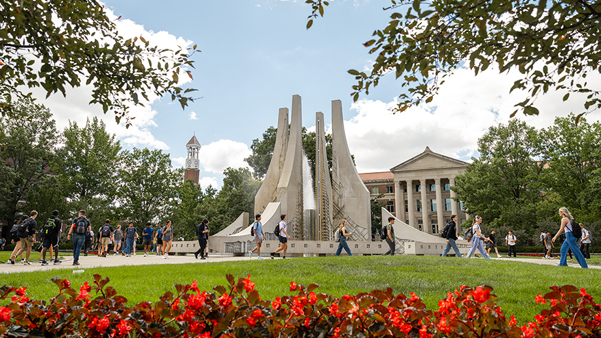 Purdue University’s Class of 1939 Water Sculpture with the Bell Tower and Hovde Hall in the background.