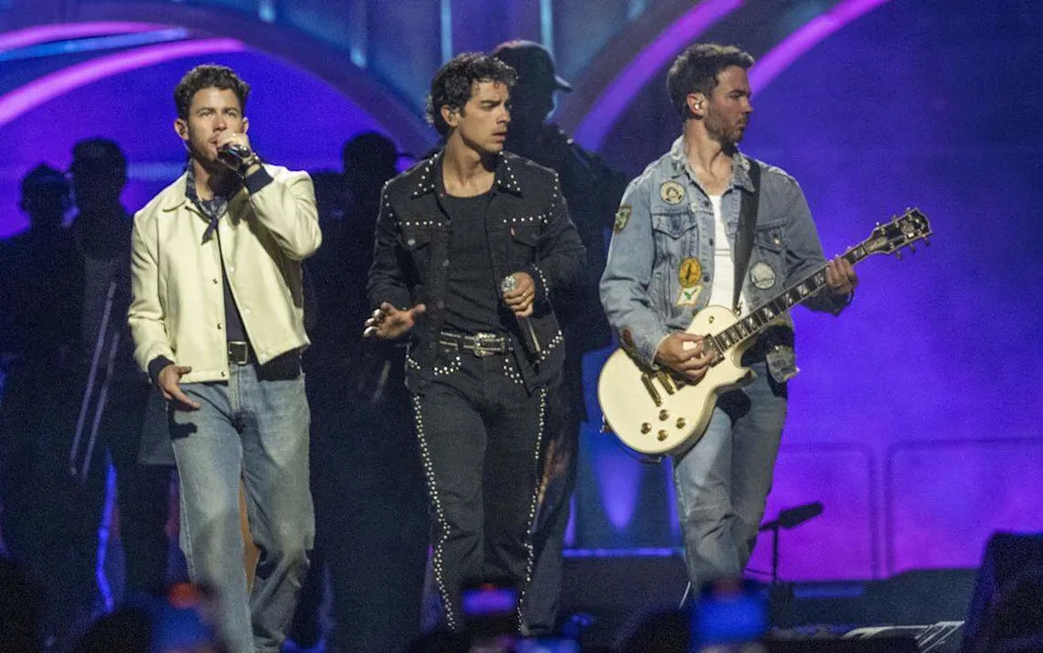 Nick, Joe and Kevin of the Jonas Brothers open their concert on Friday at Golden 1 Center.
