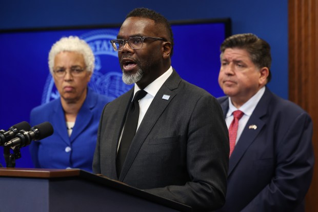 Mayor Brandon Johnson, with Cook County Board President Toni Preckwinkle, left, and Gov. JB Pritzker, address reporters on the planned deployment of federal military and Department of Homeland Security personnel to Chicago at a news conference on Sept. 2, 2025, in Chicago. (John J. Kim/Chicago Tribune)