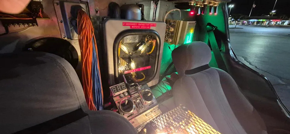 Chris Sandford a “Back to the Future” fan shows off a DeLorean time-machine he built, complete with a functioning flux capacitor. (KLAS)