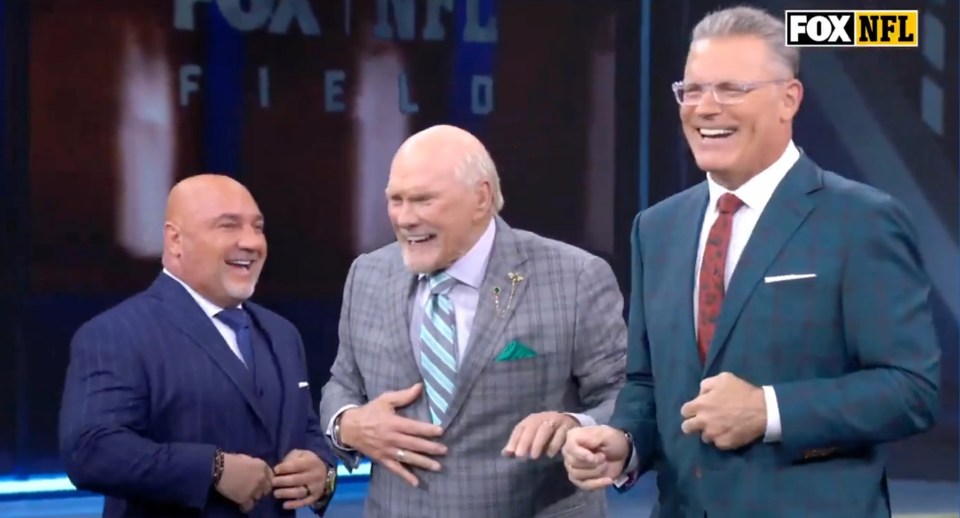 Terry Bradshaw, Howie Long, and Curt Menefee laughing on the set of FOX NFL Sunday.