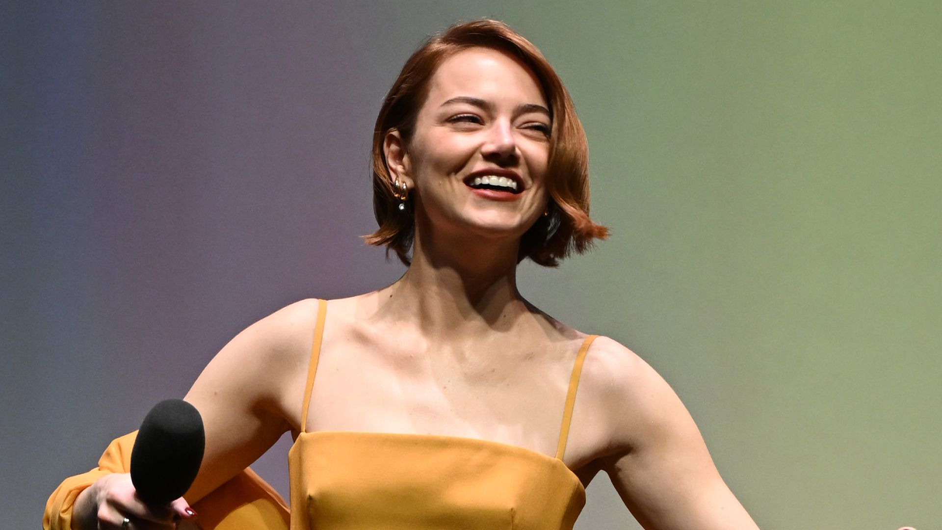 Emma Stone Embraces Taylor Swift’s Showgirl Orange Theme