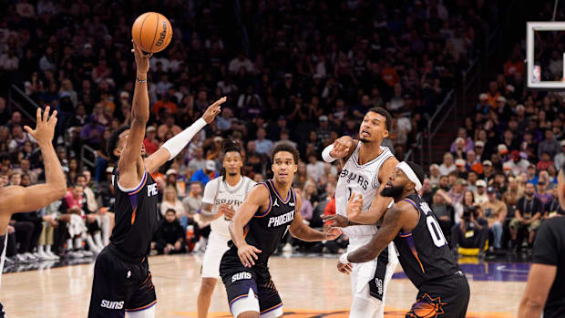 Phoenix Suns forward Ryan Dunn (0) steals a pass thrown by San Antonio Spurs forward Victor Wembanyama Phoenix Suns forward Ryan Dunn (0) steals a pass thrown by San Antonio Spurs forward Victor Wembanyama
