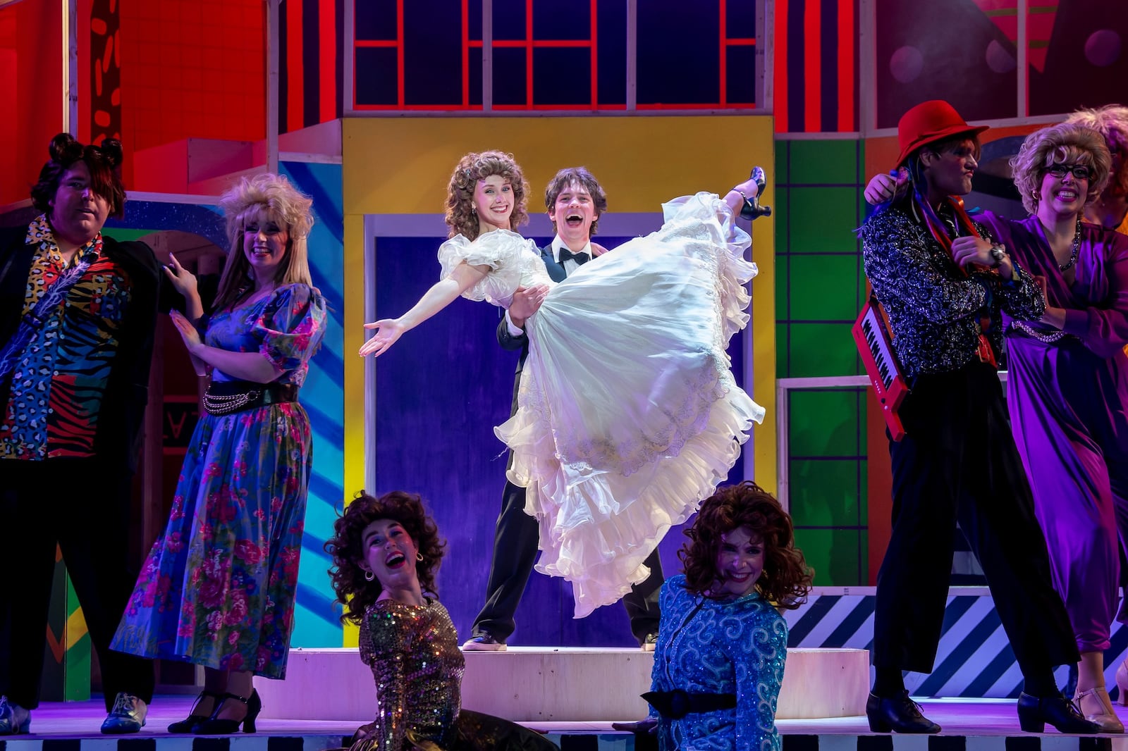 David Hap Cremean (Robbie Hart), Miranda Morrissette (Julia Sullivan) and the cast of Wright State University's production of "The Wedding Singer." Photo by Erin Pence