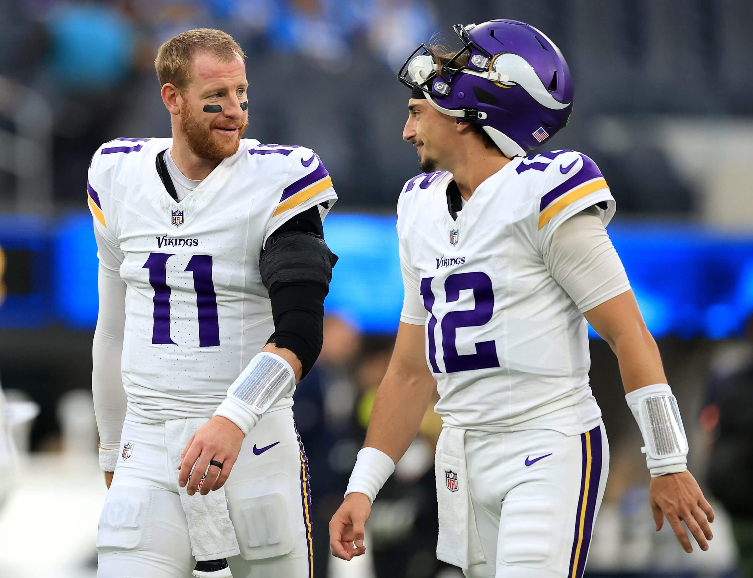 Minnesota Vikings quarterbacks Carson Wentz and Max Brosmer chat before an Oct. 23 game against the Chargers