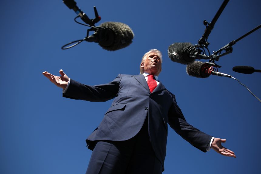 US President Donald Trump speaks to reporters as he arrives at Palm Beach International Airport on October 31, in West Palm Beach, Florida.