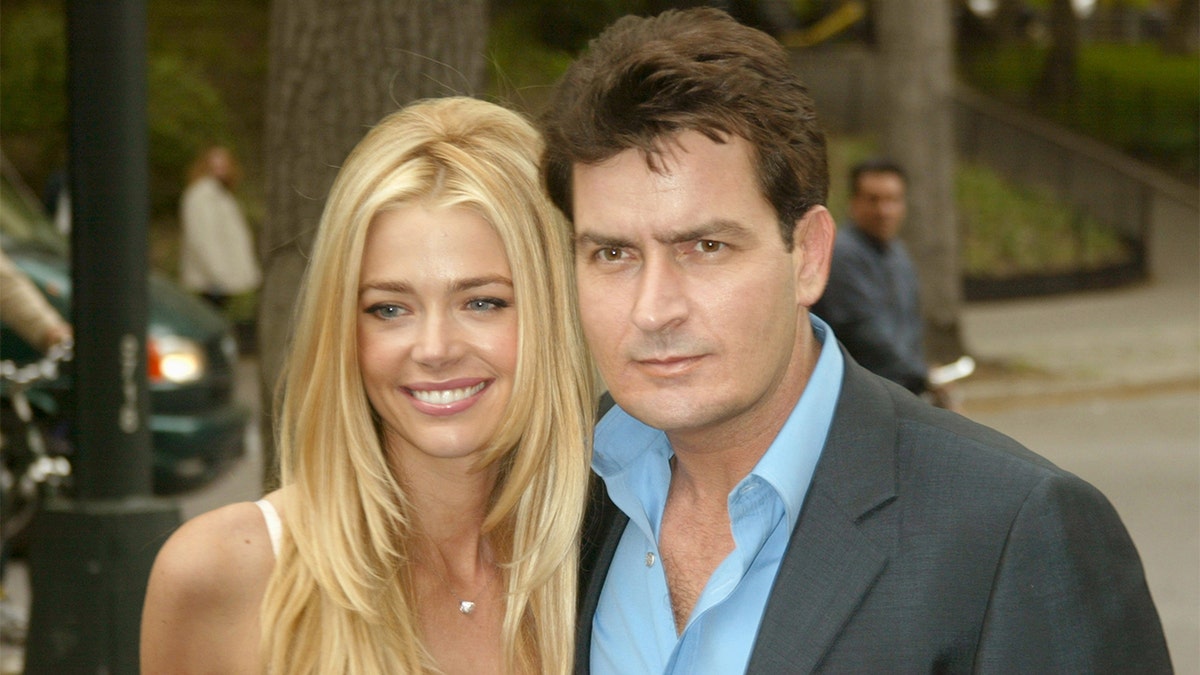 Denise Richards and Charlie Sheen smiling.