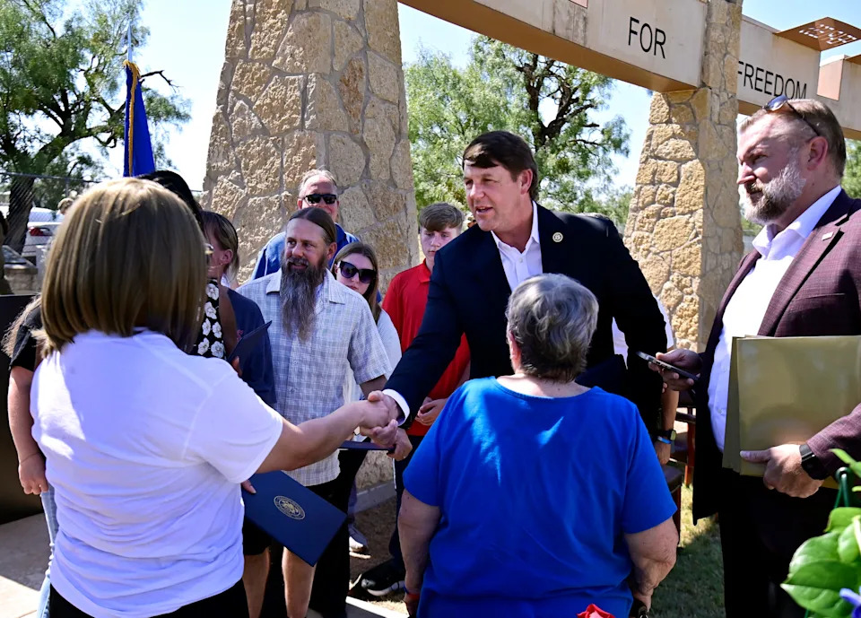U.S. Rep. Jodey Arrington, R-Lubbock, meets with family members at a memorial for the TORQE 62 aircrew at Dyess Memorial Park Oct. 2. Arrington will be on the March 3, 2026, Republican primary ballot.