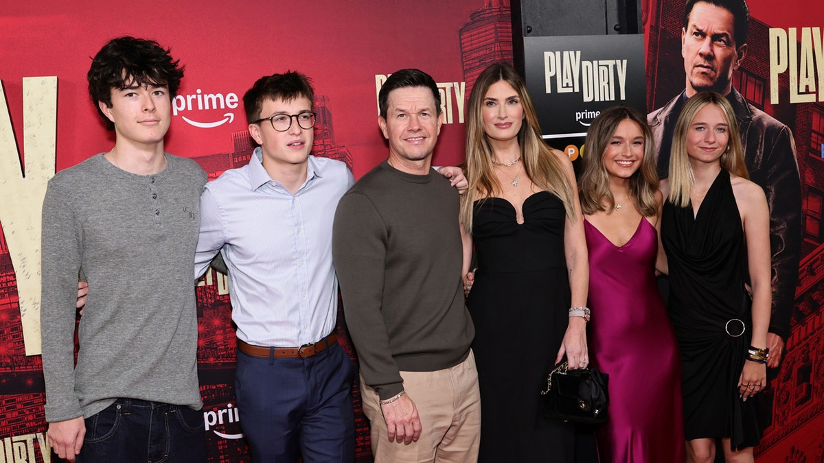 Mark Wahlberg and his wife attend a premiere with their children