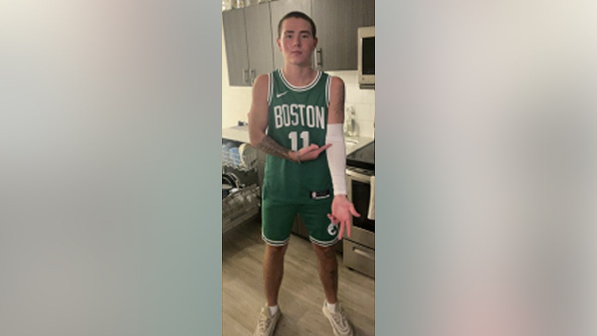 Owen Kenney in a Boston Celtics Jersey