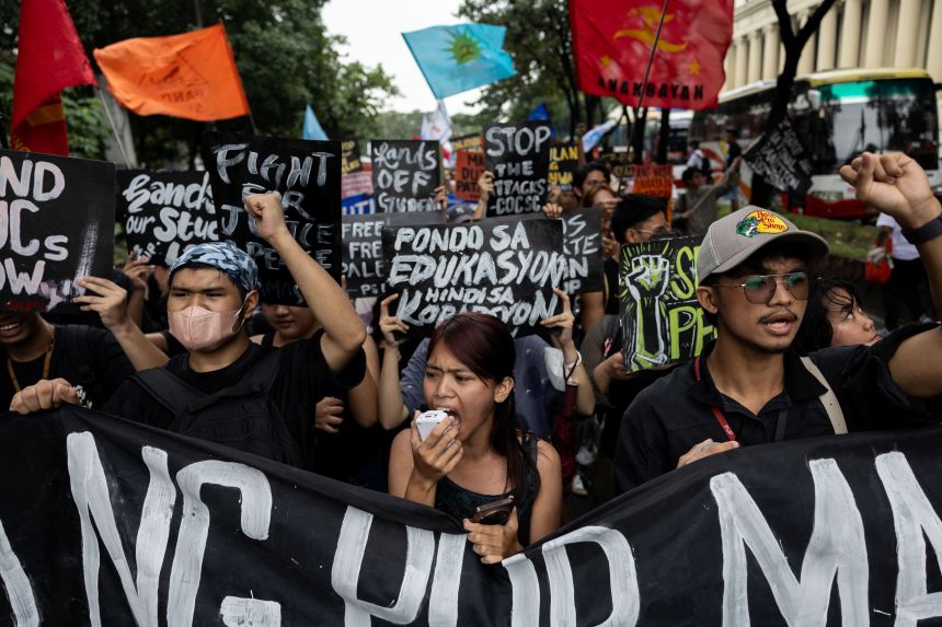 Filipino activists protest near the presidential palace on Human Rights Day in Manila, Philippines on December 10, 2025.