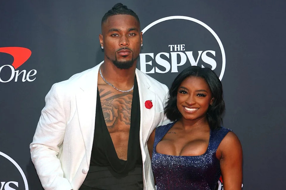 VALERIE MACON/AFP via Getty Simone Biles and Jonathan Owens.