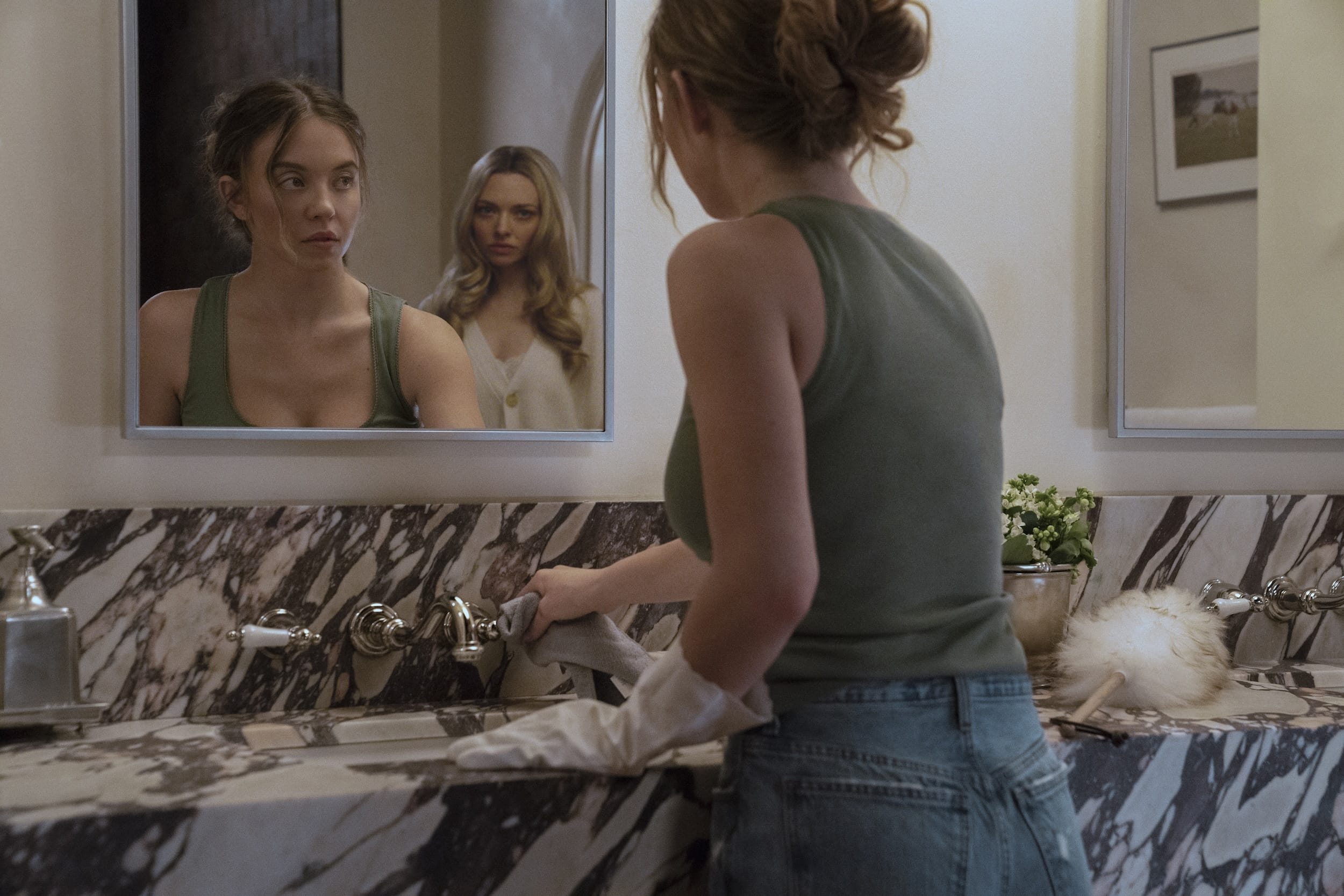 Sydney Sweeney as Millie and Amanda Seyfried as Nina in "The Housemaid."