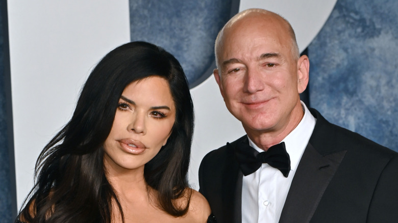Jeff Bezos and Lauren Sanchez smile at the 2023 Vanity Fair Oscar Party at the Wallis Annenberg Center in Beverly Hills, California, on March 12, 2023 (2023)