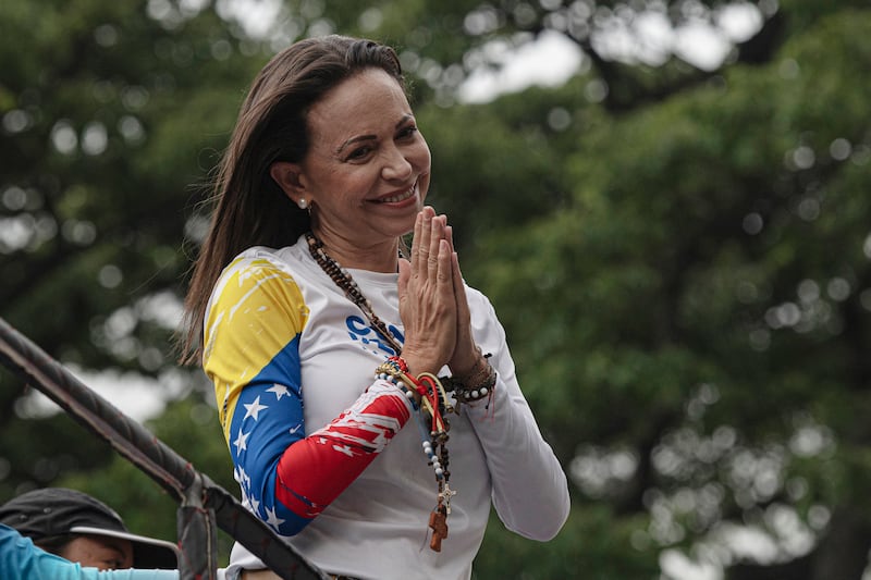 Venezuelan opposition leader Maria Corina Machado gestures to supporters during an official campaign kickoff rally ahead presidential election on July 4, 2024 in Caracas, Venezuela.