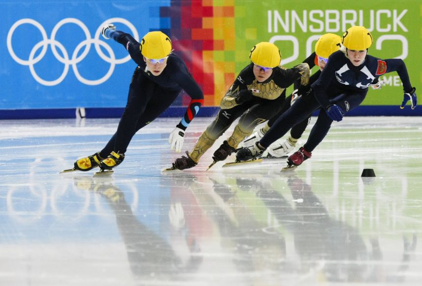Warren, left, competes in a short track event at the Youth Olympic Games in 2012.