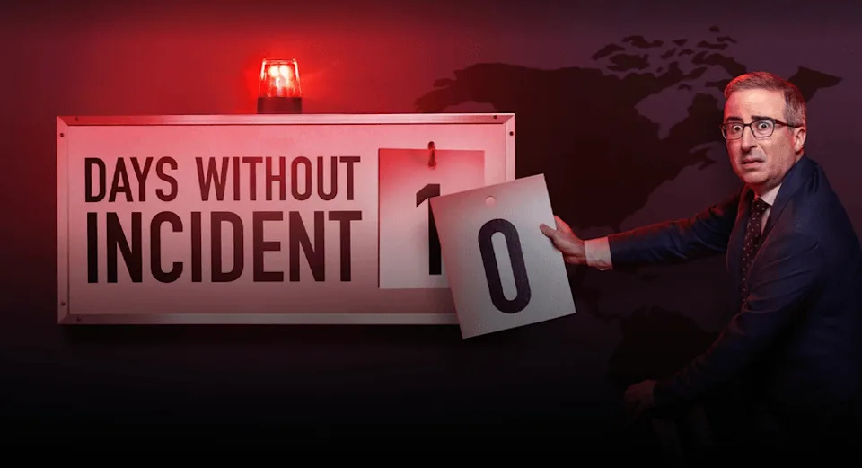 Man changing sign from 1 to 0 days without incident, red light flashing. | IMDB