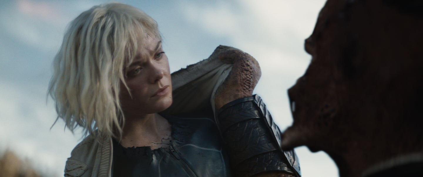 Thia (Elle Fanning) and Dek (Dimitrius Schuster-Koloamatangi) in "Predator: Badlands."