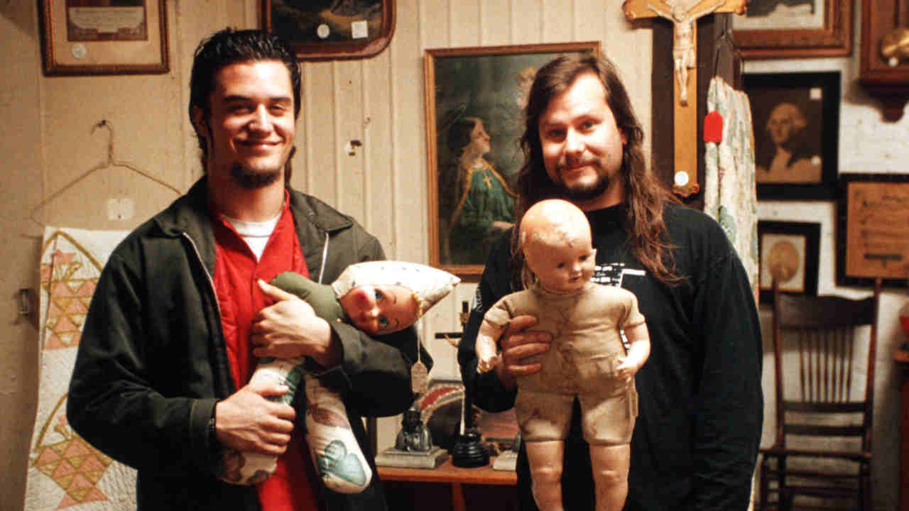 Faith No More&rsquo;s Mike Patton and Billy Gould posing for a photograph with baby dolls in 1992