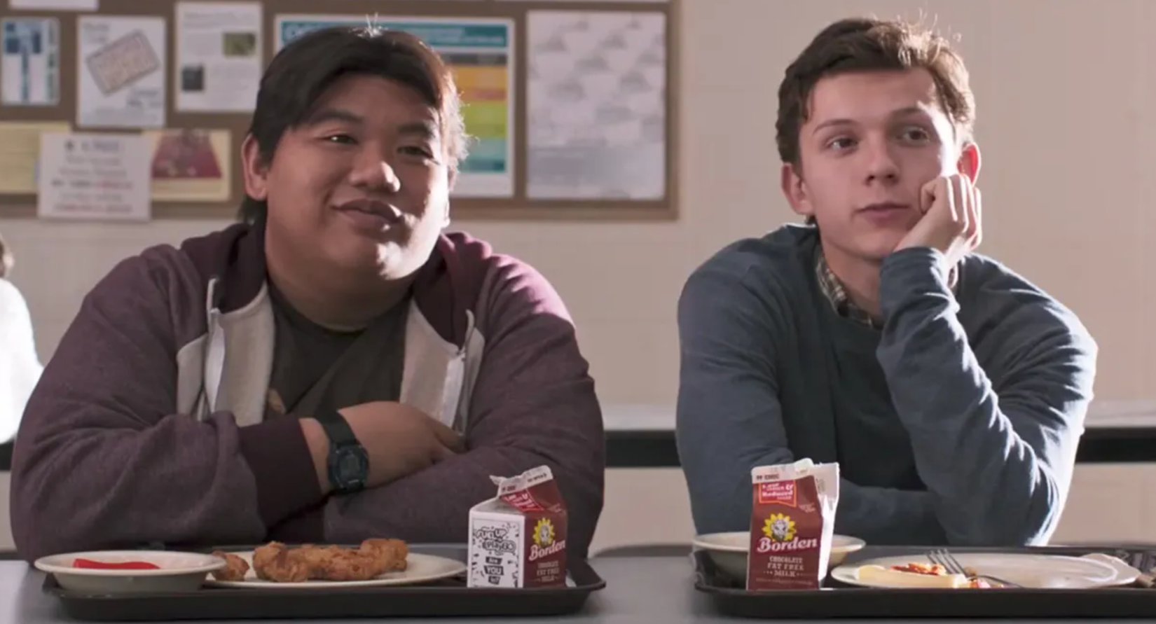Peter Parker and Ned starting at an offscreen girl longlingly while eating lunch at school in Spider-Man Homeoming