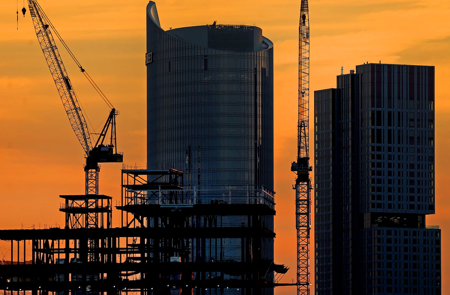 One Congress in the background of cranes building an expansion of Massachusetts General Hospital in 2024.