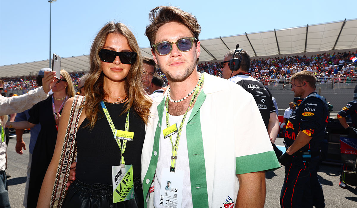 Niall Horan and Amelia Woolley pose for a photo on the grid during the F1 Grand Prix of France at Circuit Paul Ricard. Pic: Getty Images