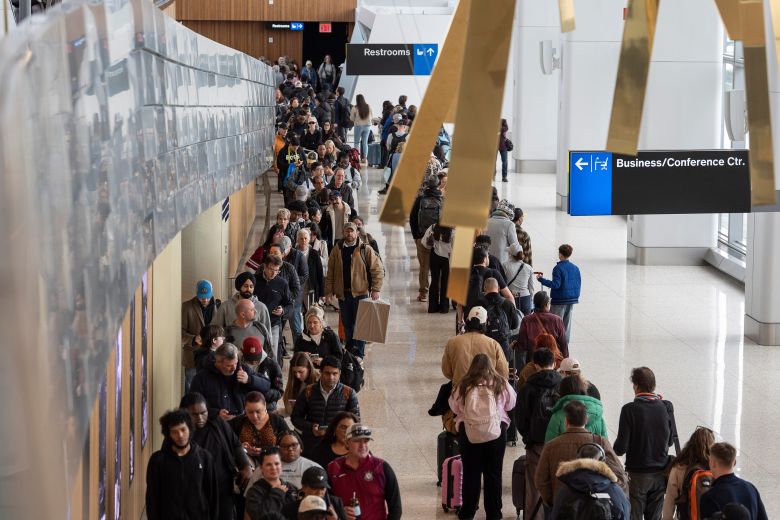 Travelers line up at a TSA checkpoint on Wednesday at LaGuardia Airport in New York. (AP Photo/Yuki Iwamura)