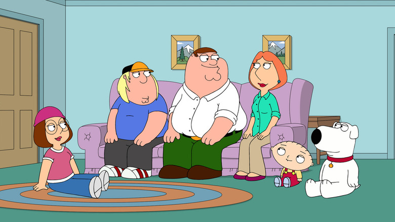 Meg, Chris, Peter, Lois, Stewie and Brian Griffin gathered on the couch in their front room on Family Guy.