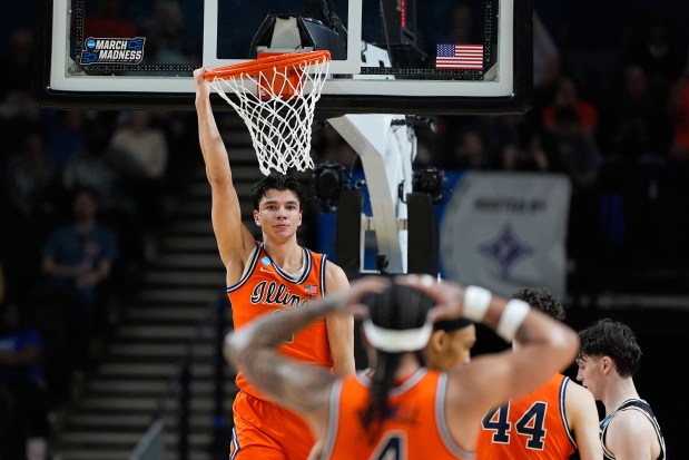 Illinois guard Andrej Stojaković (2) celebrates after dunking against VCU during the first half in the second round of the NCAA Tournament on Saturday, March 21, 2026, in Greenville, S.C. (Brynn Anderson/AP)