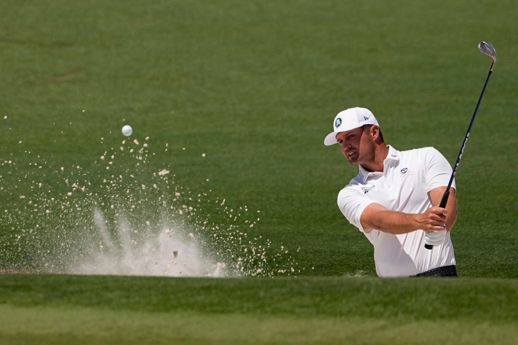 Bryson DeChambeau hits a bunker shot at The Masters on April 10, 2026.