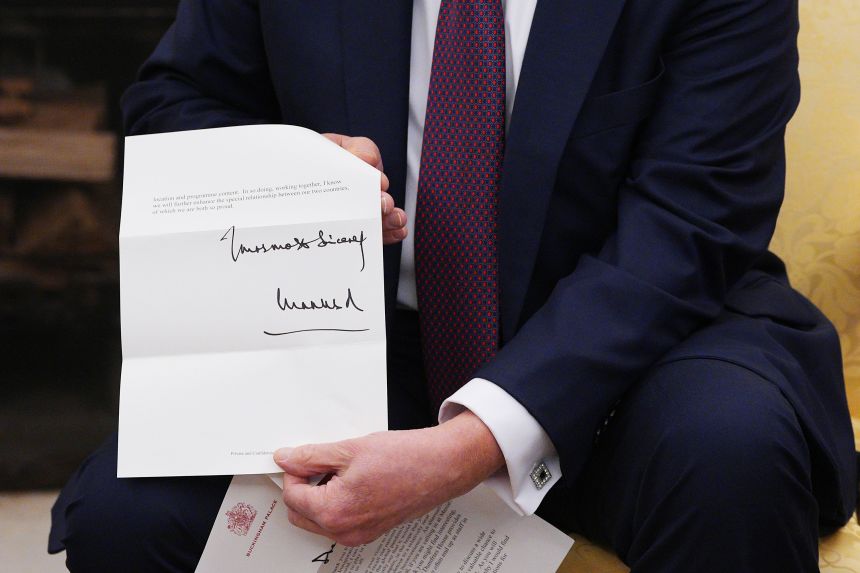 Trump shows the invitation from King Charles for a second state visit on February 27, 2025.