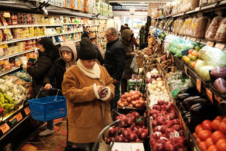 People shop at a local supermarket in New York City on April 9, 2026.