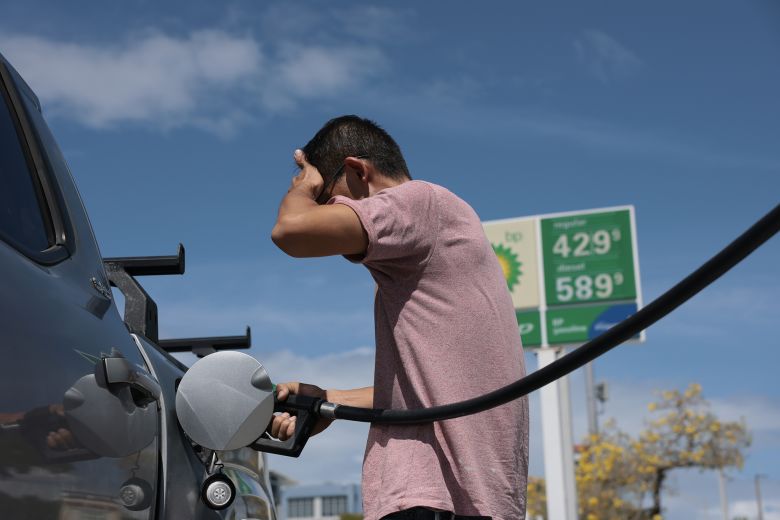 A customer puts fuel in his vehicle at a gas station on April 6, 2026, in Miami, Florida.