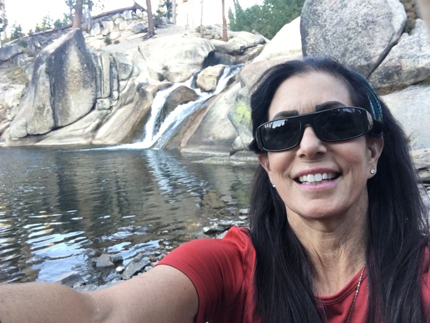 Singer, pictured on a subsequent hike years later, said she thought she could trust her friend.