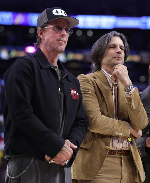 Scott Shriner and Brian Bell attending a basketball game.