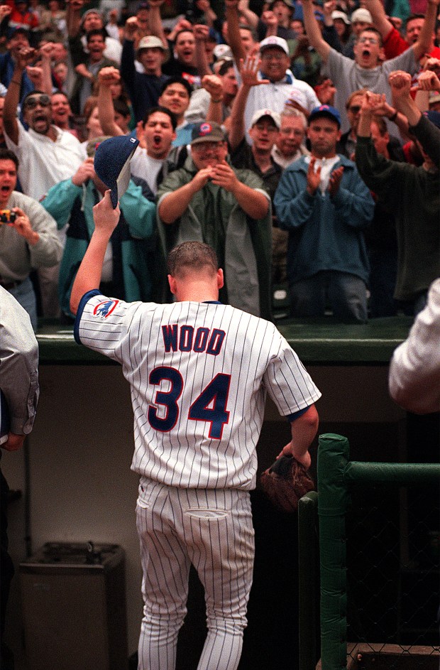 Fans react during a Chicago Cubs game where Kerry Wood (34) pitched 20 strikeouts in a one-hit shutout against the Houston Astros on May 6, 1998, at Wrigley Field. (Heather Stone/Chicago Tribune)