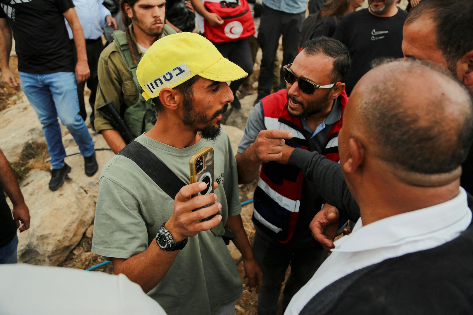 Palestinian farmers and Israeli settlers in West Hebron last year