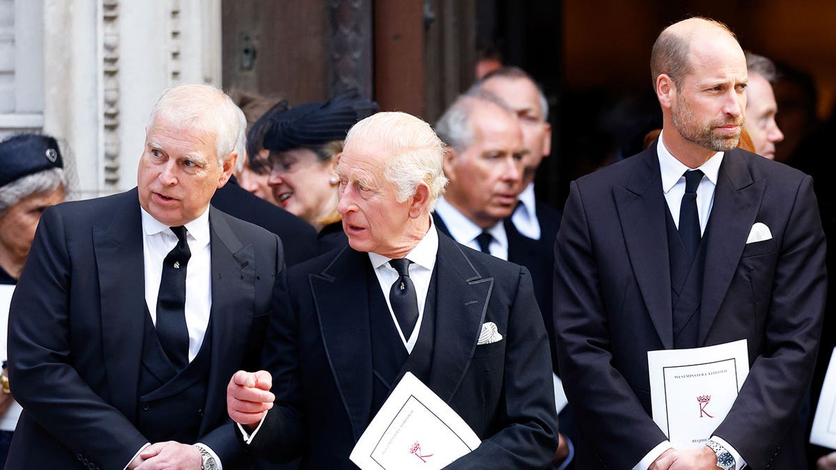 King Charles III and Prince Andrew talking while Prince William looks away at Westminster Cathedral