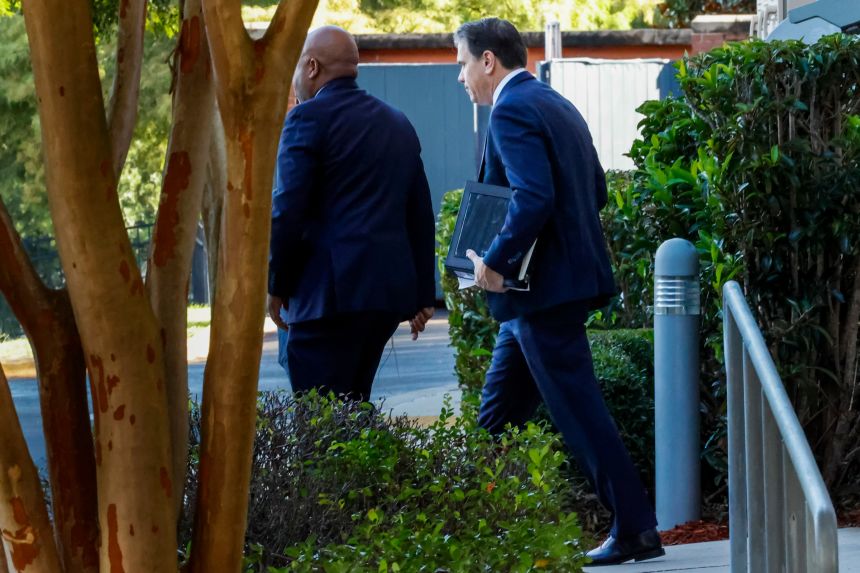 Deputy Attorney General Todd Blanche, right, leaves his hotel for the federal courthouse, Friday, July 25, 2025, in Tallahassee, Florida, to meet with Ghislaine Maxwell, the imprisoned former girlfriend of financier and convicted sex offender Jeffrey Epstein.