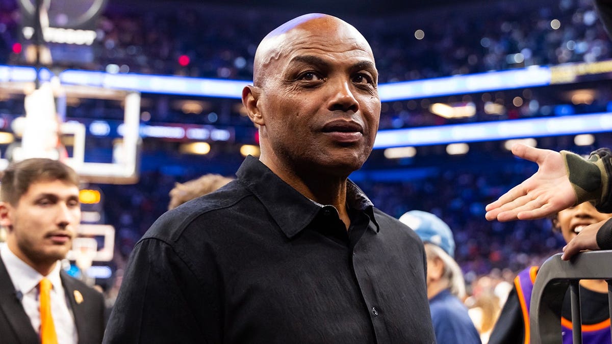 Charles Barkley standing courtside at an NBA Cup game in Phoenix