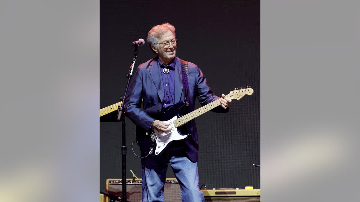Eric Clapton performing onstage at Crypto.com Arena in Los Angeles