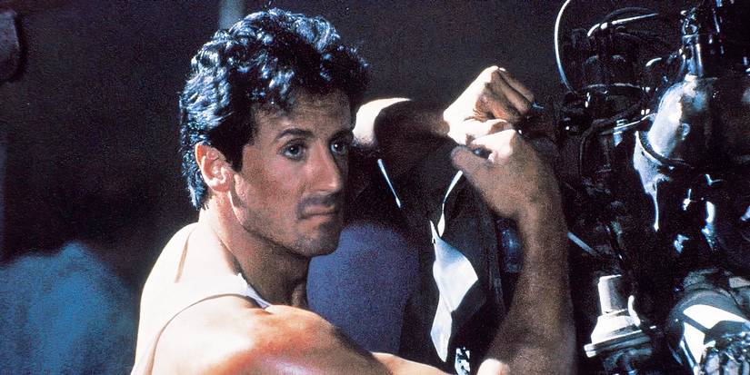 Sylvester Stallone holds on to an engine in Lock Up